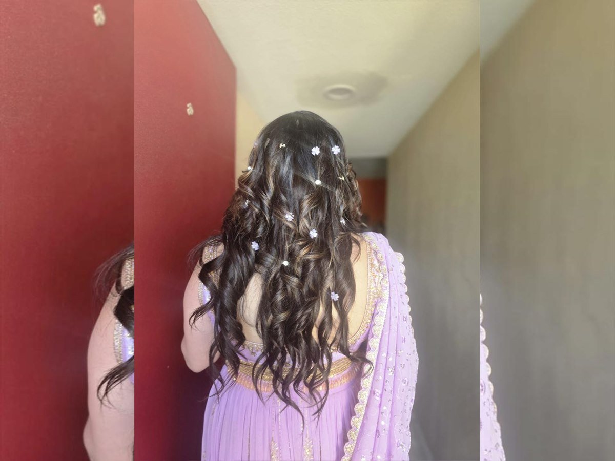 Lavender outfit curled hairstyle back view